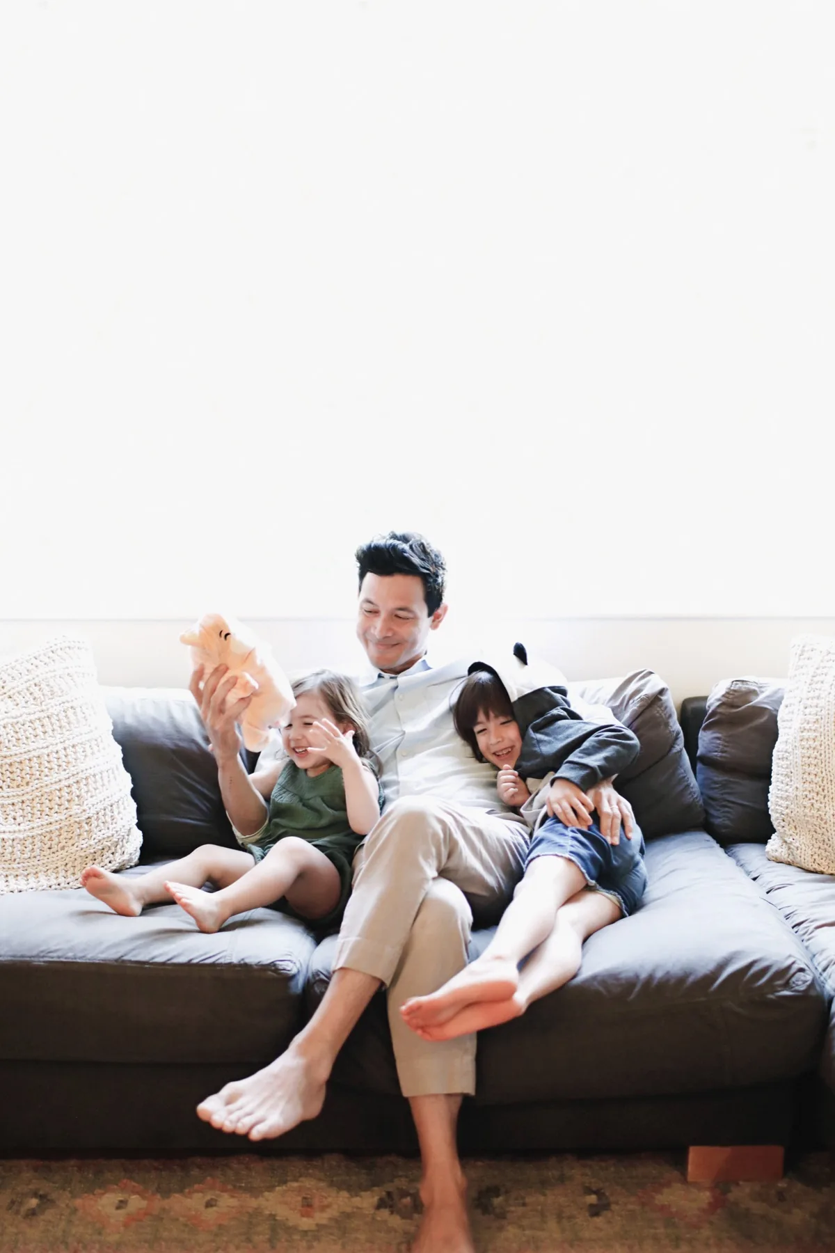 Family relaxing with Cubcoats plush toys